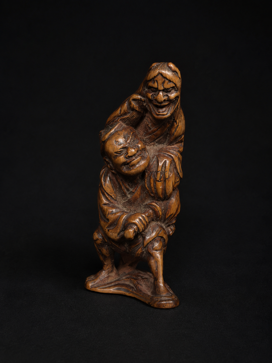 Netsuke Edo Hannya atacando a un samurái