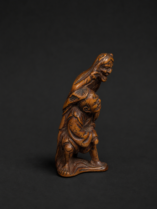 Netsuke Edo Hannya atacando a un samurái
