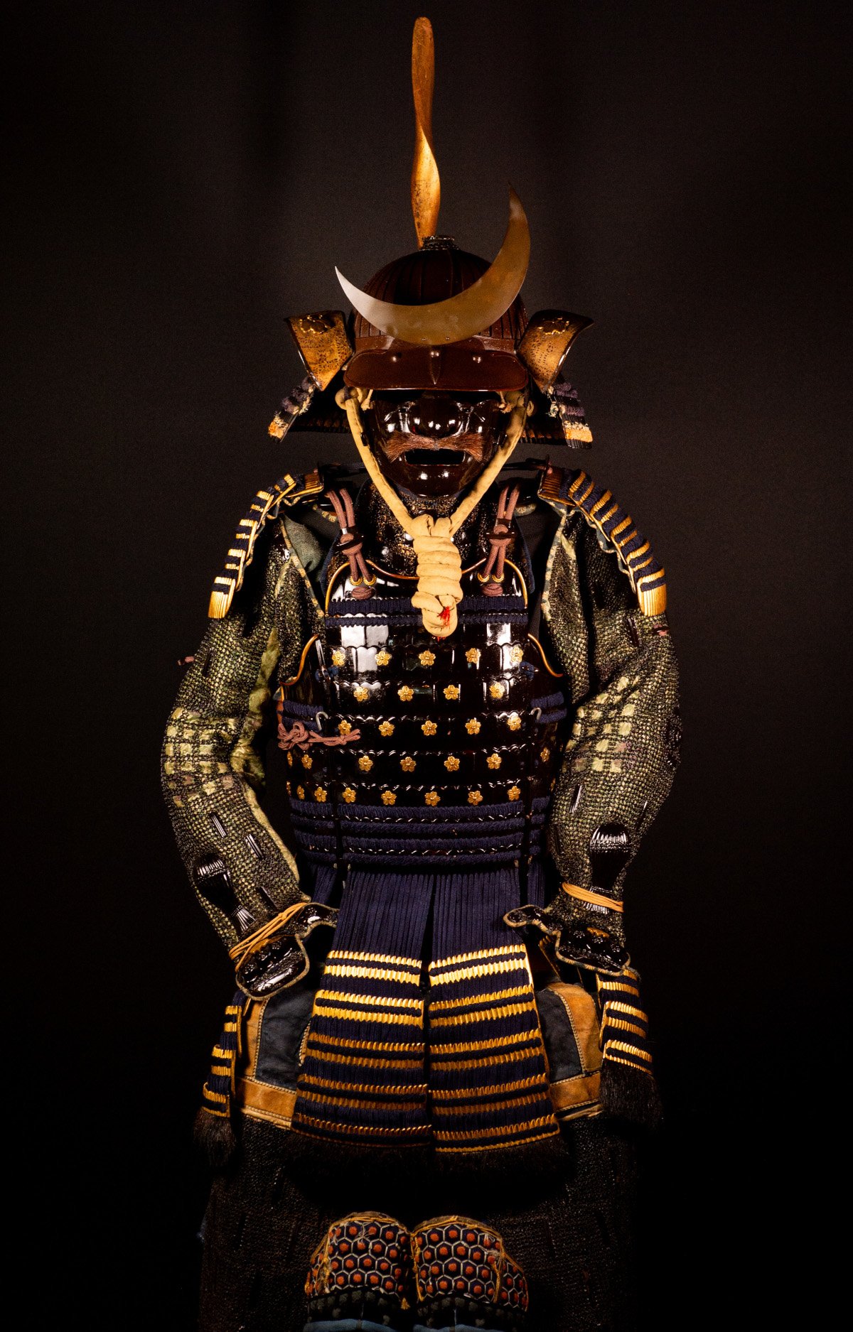 Edo-period Japanese samurai armor with crescent-moon maedate, Tokugawa mitsuba-aoi crests and indigo lacing