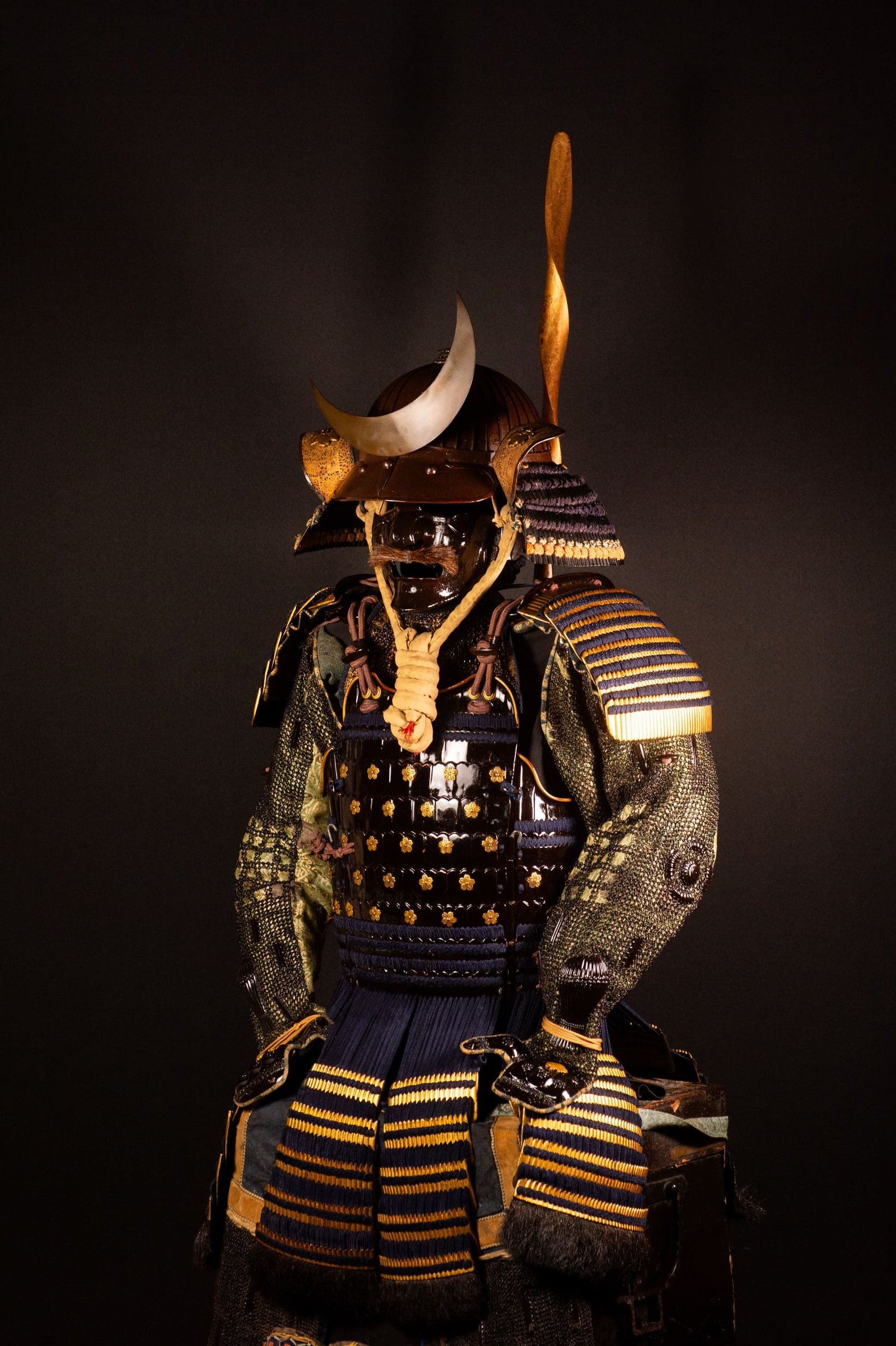 Edo-period Japanese samurai armor with crescent-moon maedate, Tokugawa mitsuba-aoi crests and indigo lacing