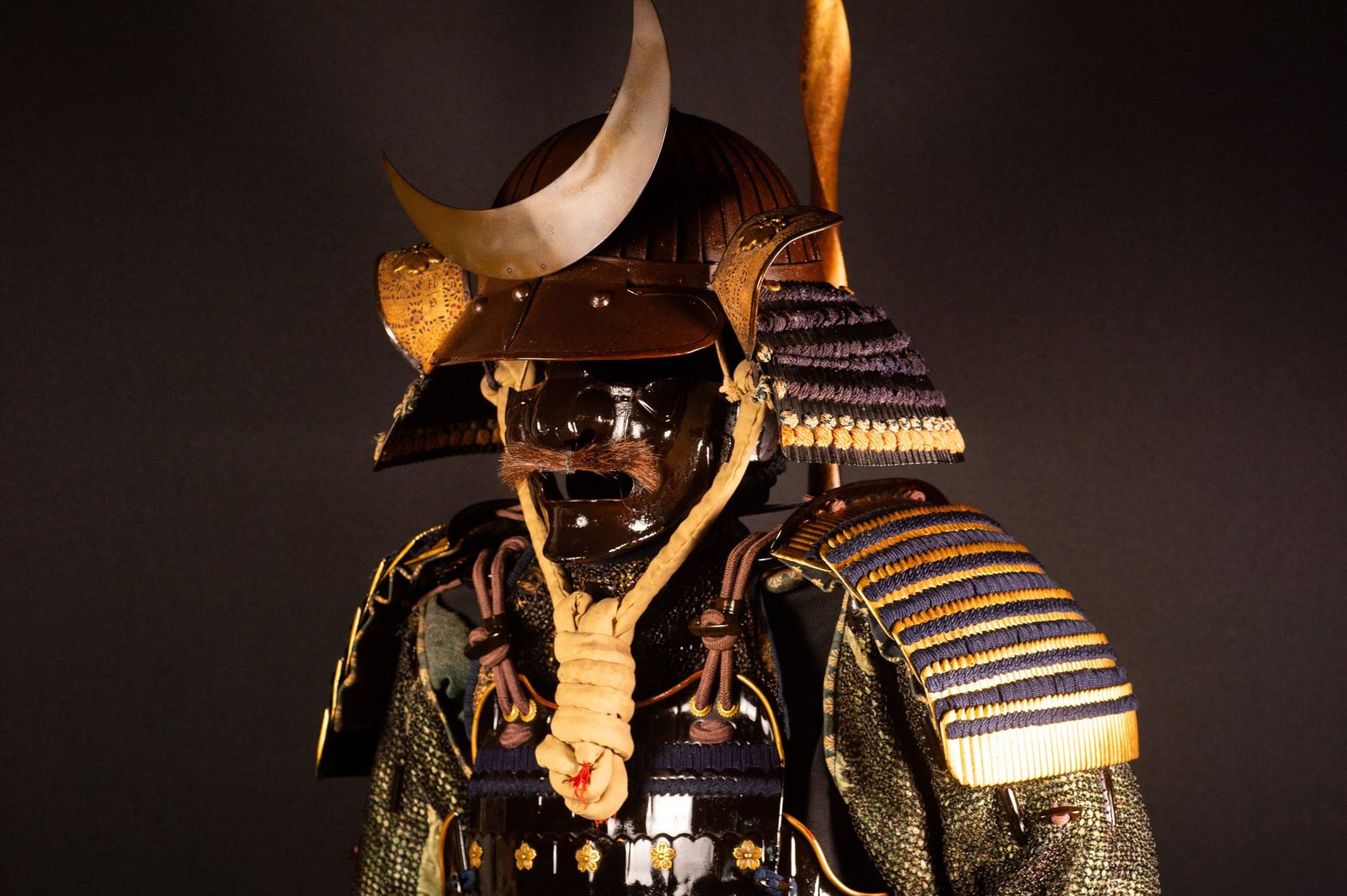 Edo-period Japanese samurai armor with crescent-moon maedate, Tokugawa mitsuba-aoi crests and indigo lacing