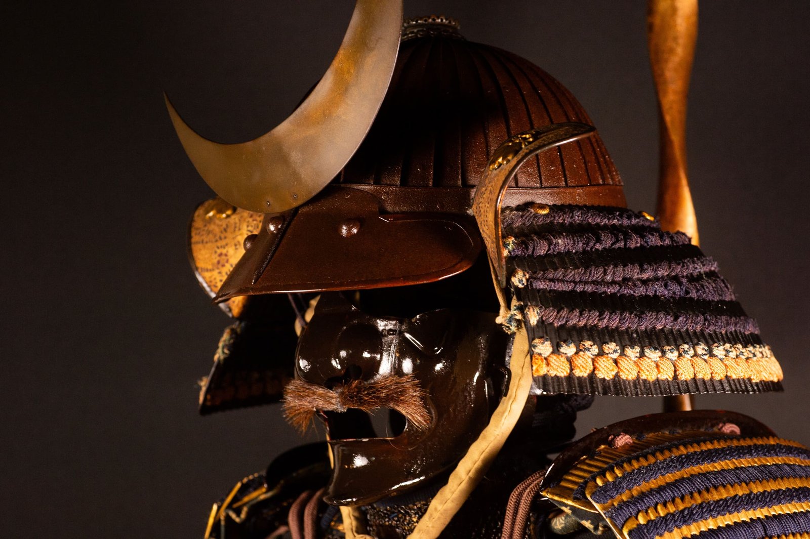 Edo-period Japanese samurai armor with crescent-moon maedate, Tokugawa mitsuba-aoi crests and indigo lacing