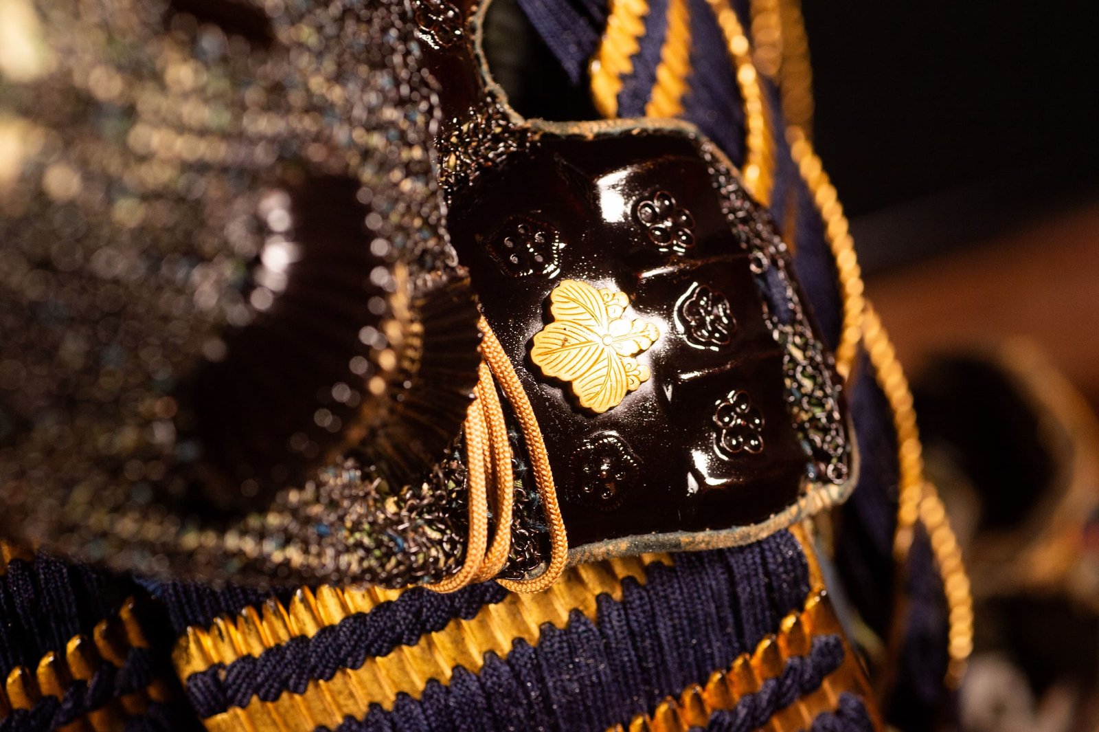 Edo-period Japanese samurai armor with crescent-moon maedate, Tokugawa mitsuba-aoi crests and indigo lacing