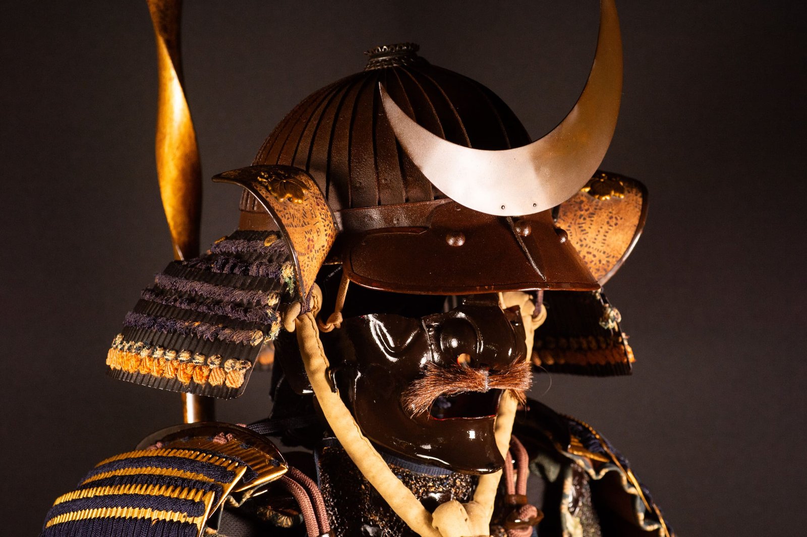 Edo-period Japanese samurai armor with crescent-moon maedate, Tokugawa mitsuba-aoi crests and indigo lacing