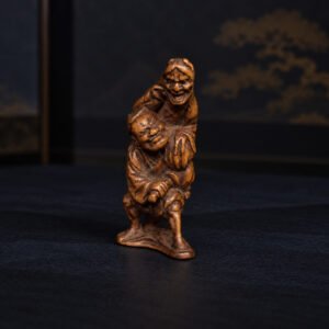 Katabori-netsuke snijwerk – scène met Hannya en samoerai