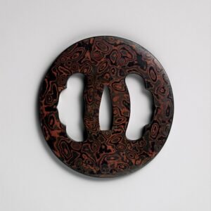 Zwaardstootplaat (tsuba): gelaagd metaal (mokume-gane), ijzer, koper-goudlegering (shakudō) en koper