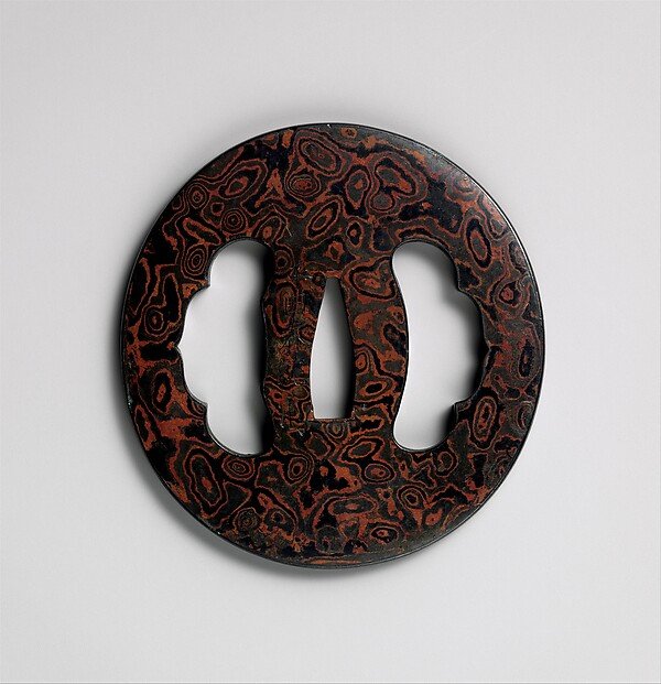Sword Guard (Tsuba) — Metal laminate (mokume-gane), iron, copper-gold alloy (shakudō), copper